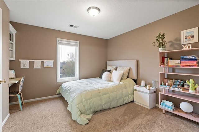bedroom with carpet floors and baseboards
