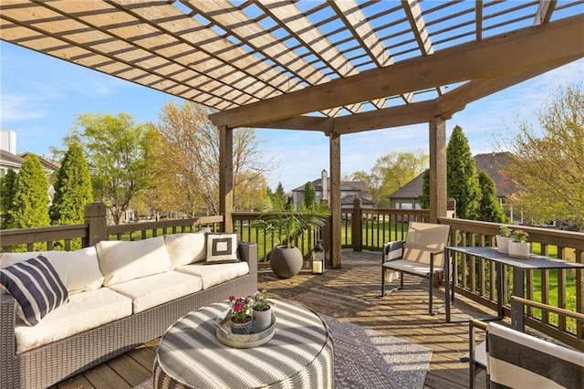 wooden terrace with outdoor lounge area and a pergola