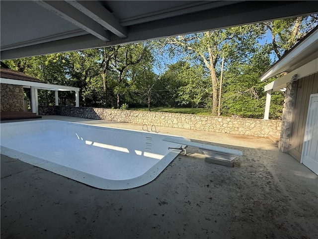 view of swimming pool featuring a patio