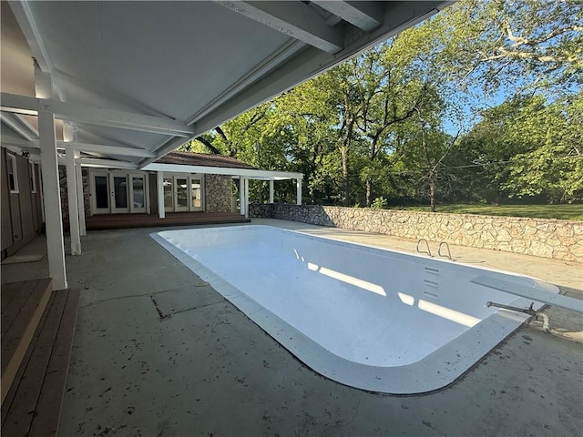 view of car parking with french doors