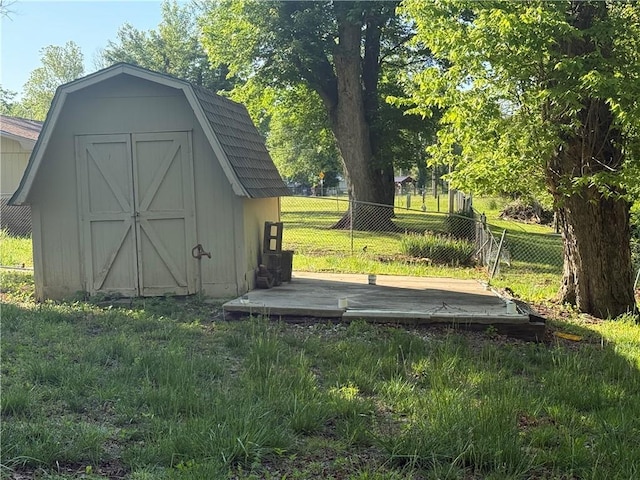 view of shed with fence