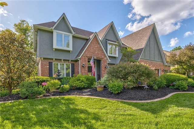 8618 W 138th Ter, Overland Park, KS 66223 - tudor house with a front yard, brick siding, and stucco siding