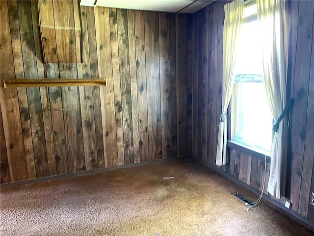509 Whitcomb St, Lathrop, MO 64465 - carpeted spare room featuring wood walls