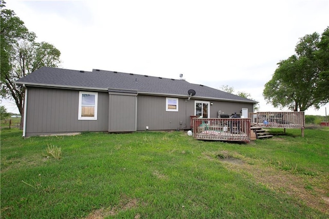 29208 E 343rd St, Garden City, MO 64747 - rear view of house with a lawn and a wooden deck