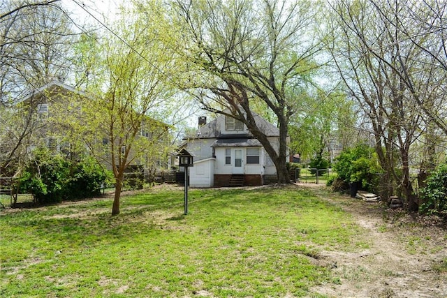 1221 Morgan Ave, Parsons, KS 67357 - view of yard with entry steps and fence