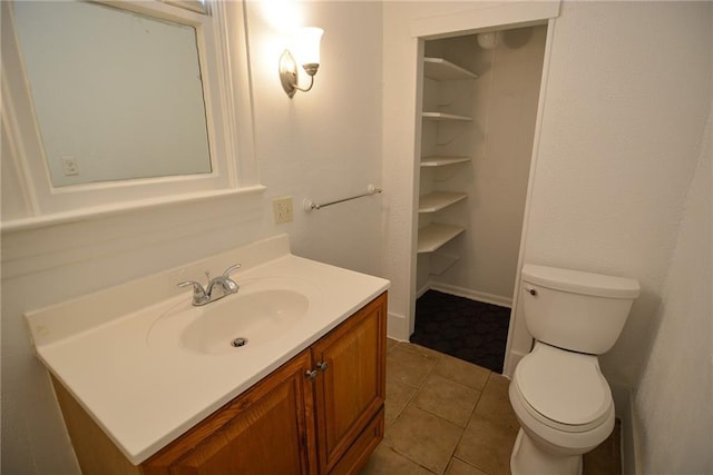 1221 Morgan Ave, Parsons, KS 67357 - bathroom with toilet, tile patterned flooring, and vanity