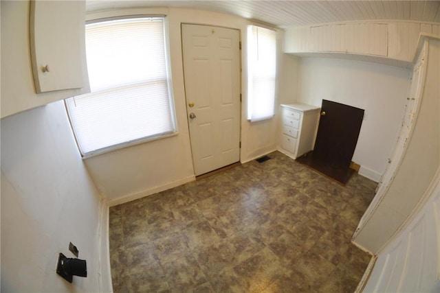 1221 Morgan Ave, Parsons, KS 67357 - entryway featuring dark floors, visible vents, and baseboards