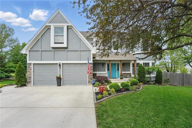 view of front of home featuring driveway, covered porch, stone siding, and stucco siding