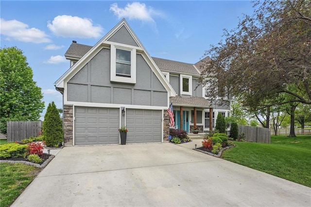 view of front facade featuring an attached garage, stone siding, stucco siding, and driveway