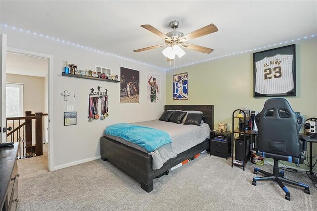 carpeted bedroom featuring baseboards