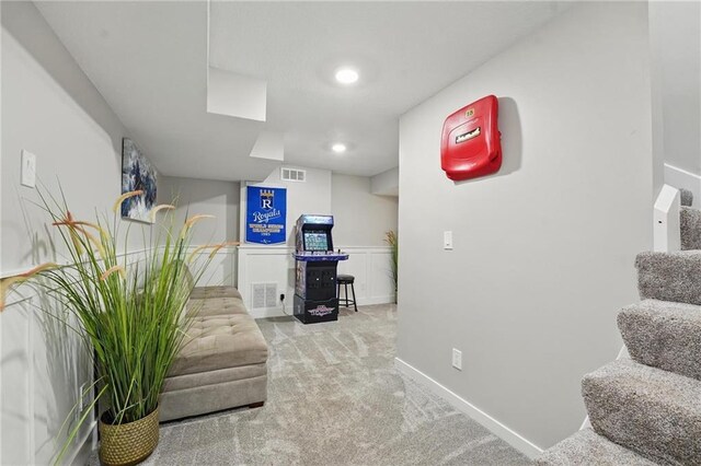 living area featuring carpet floors, baseboards, and recessed lighting