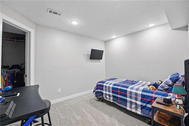 bedroom featuring carpet floors, baseboards, and recessed lighting