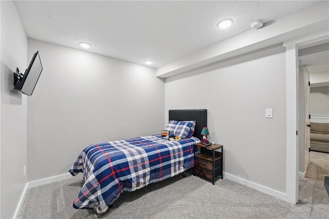 bedroom featuring carpet flooring, baseboards, and recessed lighting