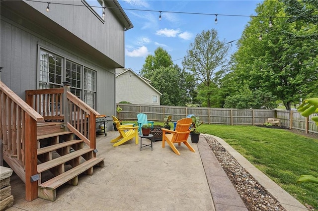 view of patio with an outdoor fire pit