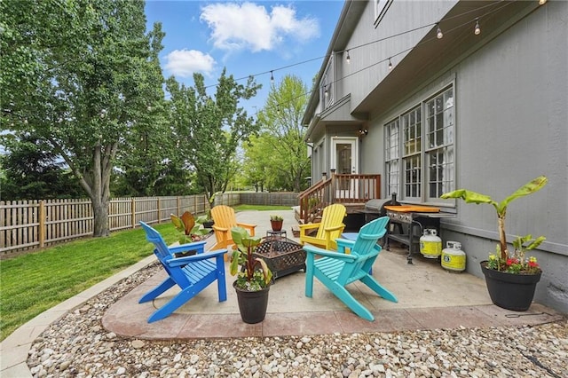 view of patio / terrace featuring an outdoor fire pit