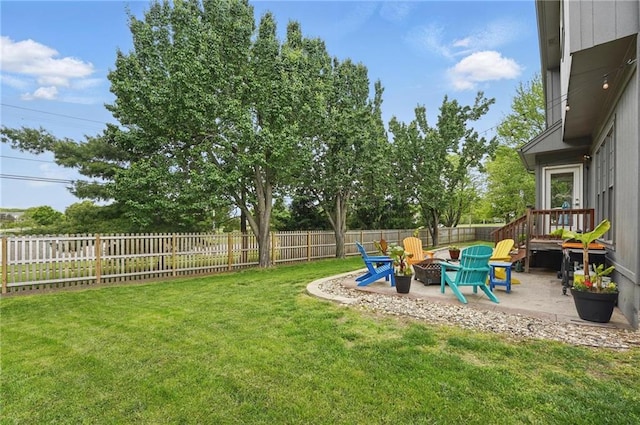 view of yard with an outdoor fire pit and a patio
