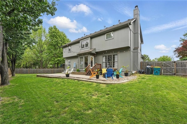 rear view of property with a patio and a chimney