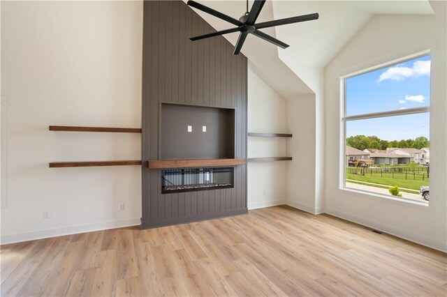 1604 Mulberry St, Pleasant Hill, MO 64080 - unfurnished living room with light wood finished floors, a ceiling fan, lofted ceiling, and baseboards