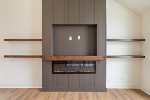 1604 Mulberry St, Pleasant Hill, MO 64080 - detailed view of wood finished floors and baseboards