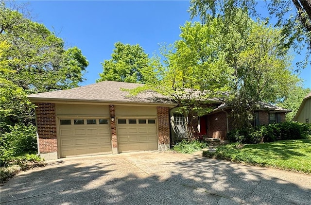 5212 Somerset Dr, Prairie Village, KS 66207 - ranch-style house with brick siding, an attached garage, concrete driveway, and a front yard