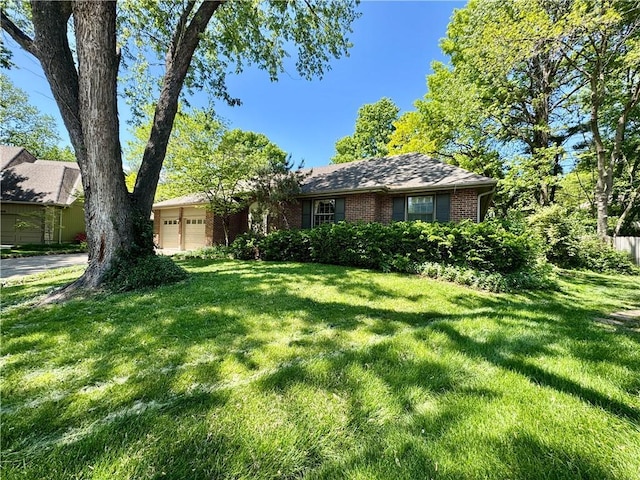 5212 Somerset Dr, Prairie Village, KS 66207 - view of front of property featuring brick siding, a garage, and a front yard