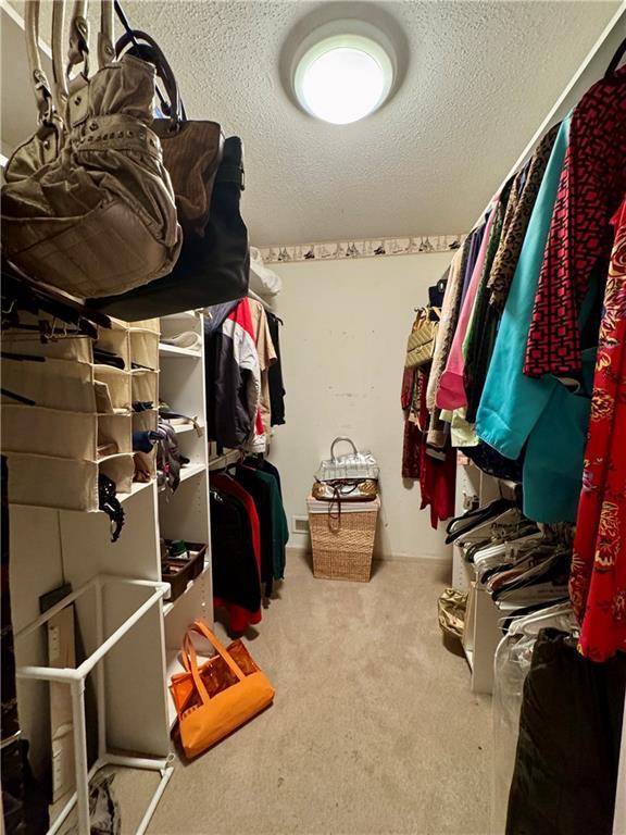 5212 Somerset Dr, Prairie Village, KS 66207 - spacious closet featuring carpet floors