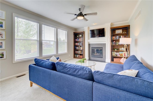 8812 NE 101st St, Kansas City, MO 64157 - carpeted living room featuring a fireplace, baseboards, crown molding, and a ceiling fan