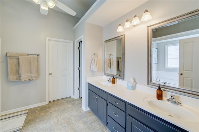 8812 NE 101st St, Kansas City, MO 64157 - full bath featuring a ceiling fan, baseboards, double vanity, and a tub