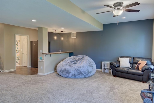 8812 NE 101st St, Kansas City, MO 64157 - living area with carpet floors, ceiling fan, recessed lighting, and baseboards