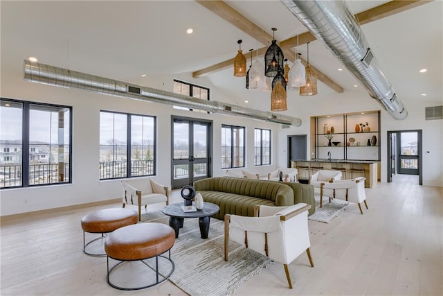 interior space with french doors, visible vents, recessed lighting, a chandelier, and light wood finished floors