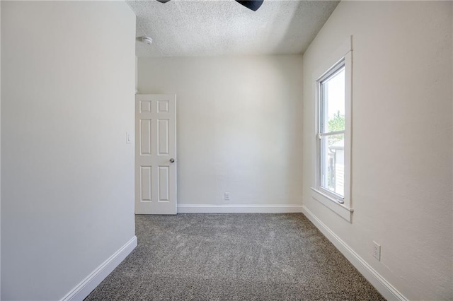 217 N Valley St, Kansas City, KS 66102 - carpeted empty room featuring a textured ceiling, a ceiling fan, and baseboards