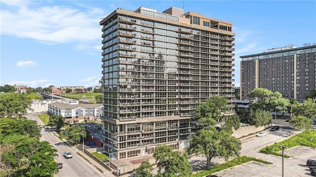view of apartment building / complex with a city view