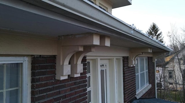exterior space featuring brick siding