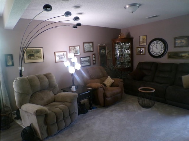 carpeted living room with visible vents