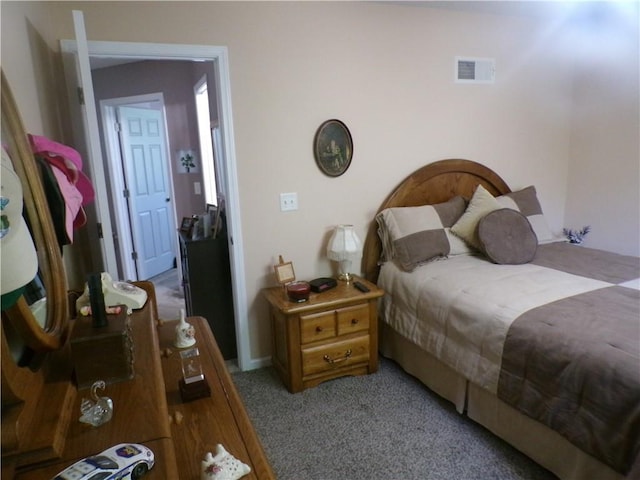 bedroom featuring carpet floors and visible vents