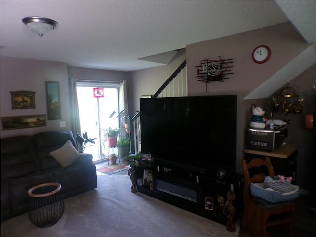 living room with carpet flooring and stairway
