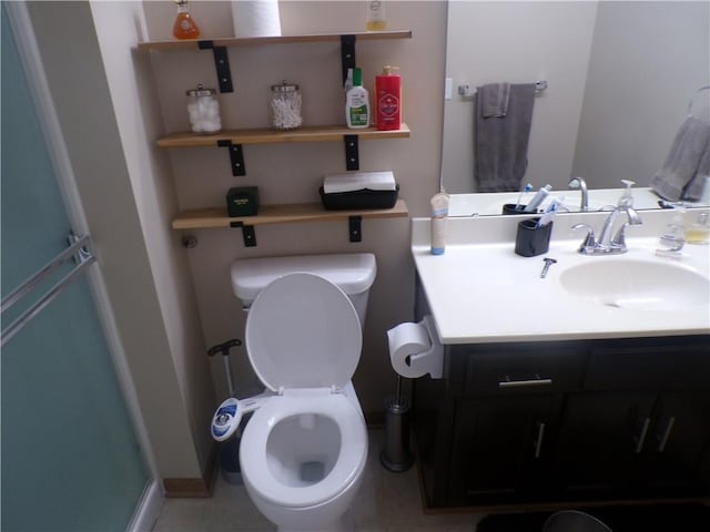 bathroom featuring toilet and vanity