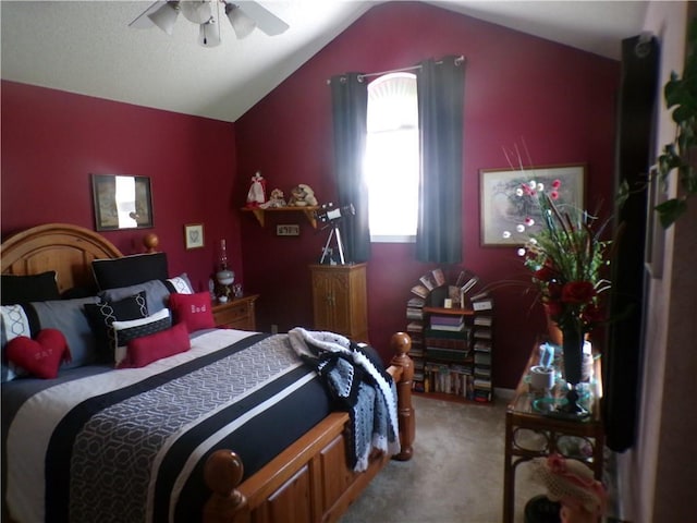 bedroom with lofted ceiling, ceiling fan, and carpet
