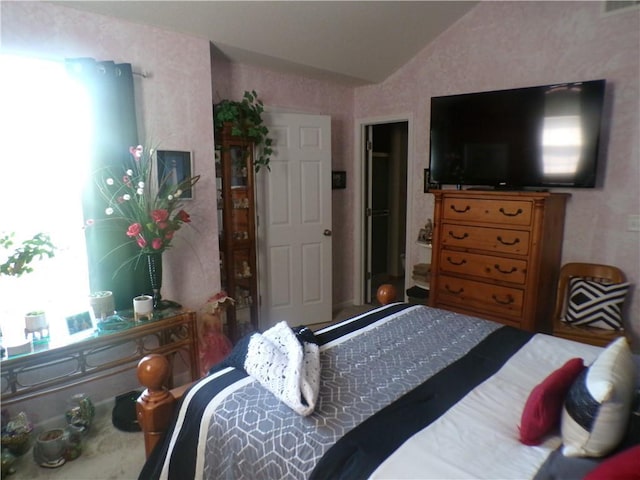 bedroom featuring lofted ceiling