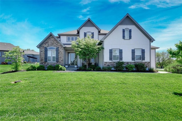 24411 W 70th St, Shawnee, KS 66226 - view of front of home with stone siding, stucco siding, and a front yard