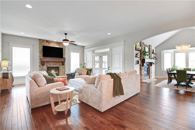 24411 W 70th St, Shawnee, KS 66226 - living area with a stone fireplace, ceiling fan, healthy amount of natural light, recessed lighting, and vaulted ceiling