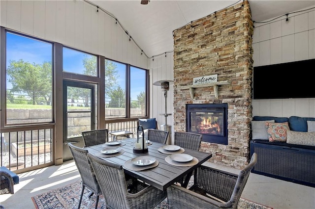 24411 W 70th St, Shawnee, KS 66226 - sunroom / solarium featuring a fireplace, lofted ceiling, and outdoor dining space