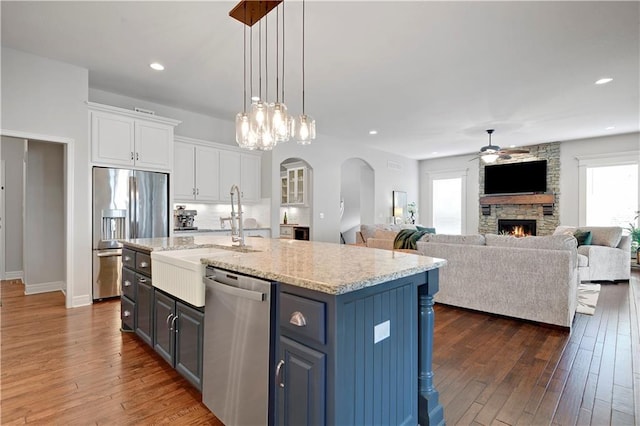 24411 W 70th St, Shawnee, KS 66226 - kitchen featuring stainless steel appliances, a ceiling fan, white cabinetry, dark wood-style floors, and recessed lighting
