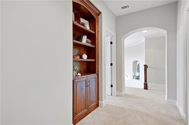 24411 W 70th St, Shawnee, KS 66226 - hallway with arched walkways, carpet, baseboards, and crown molding