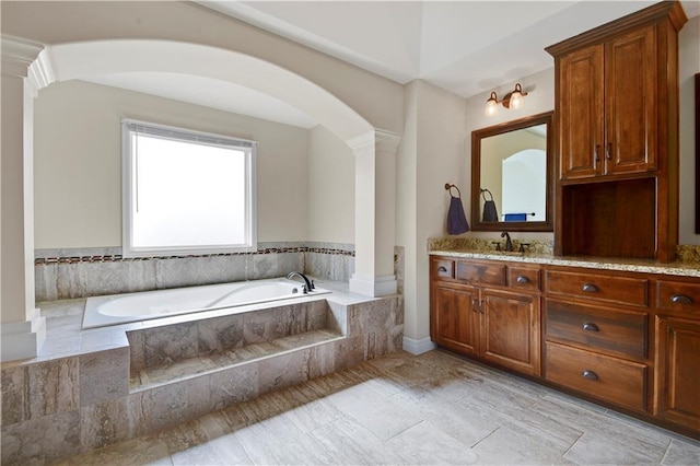 24411 W 70th St, Shawnee, KS 66226 - bathroom featuring ornate columns, vanity, and a bath