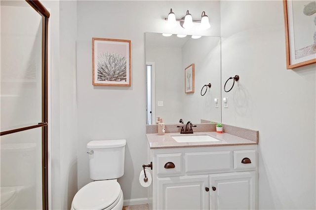 24411 W 70th St, Shawnee, KS 66226 - bathroom featuring toilet, vanity, and a shower