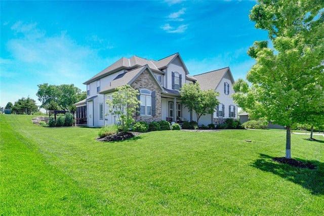 24411 W 70th St, Shawnee, KS 66226 - view of side of property featuring stone siding, stucco siding, and a lawn