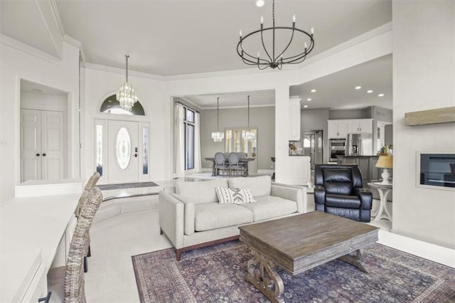 carpeted living area with a chandelier, crown molding, and recessed lighting