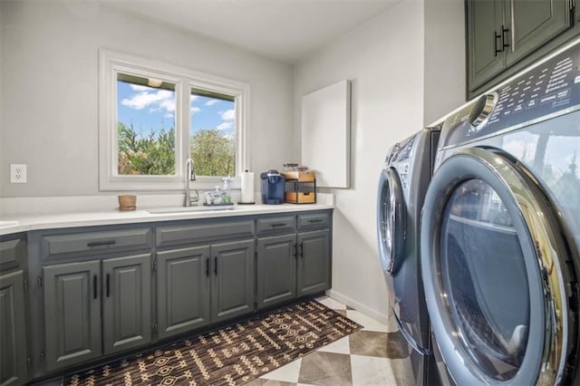 laundry room featuring cabinet space, washing machine and clothes dryer, and baseboards