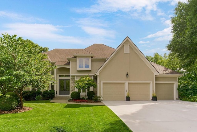 12912 Woodson St, Leawood, KS 66209 - view of front of property featuring french doors, stucco siding, concrete driveway, a garage, and a front yard